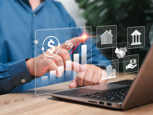 Close-up of two people’s hands writing while having a discussion.